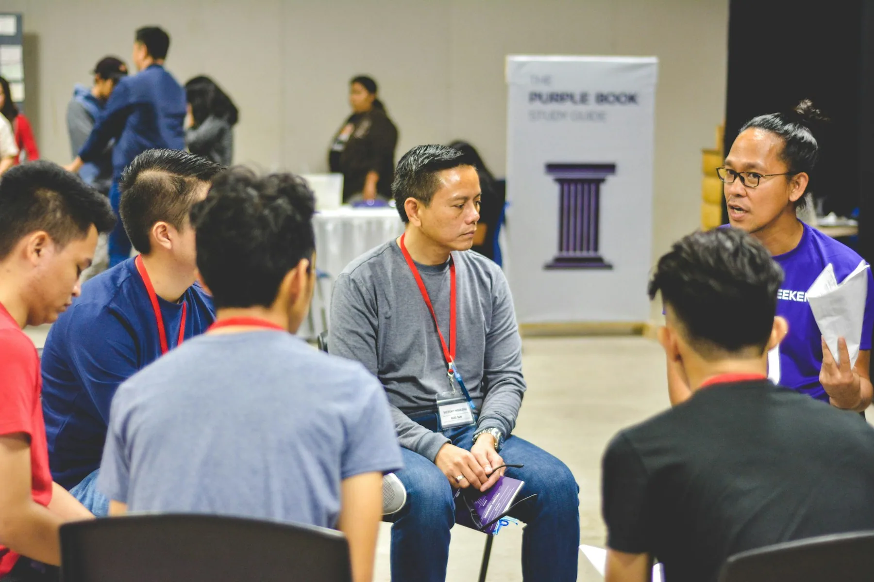 A team discussing an answer during a quiz